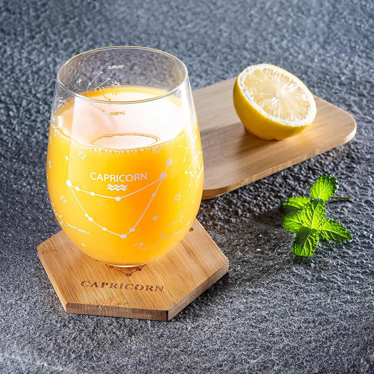 Set of 2 Zodiac Sign Wine Glasses with 2 Wooden Coasters by The Wine Savant - Astrology Drinking Glass Set with Etched Constellation Tumblers for Juice, Water Home Bar Horoscope Gifts 18oz (Capricorn)